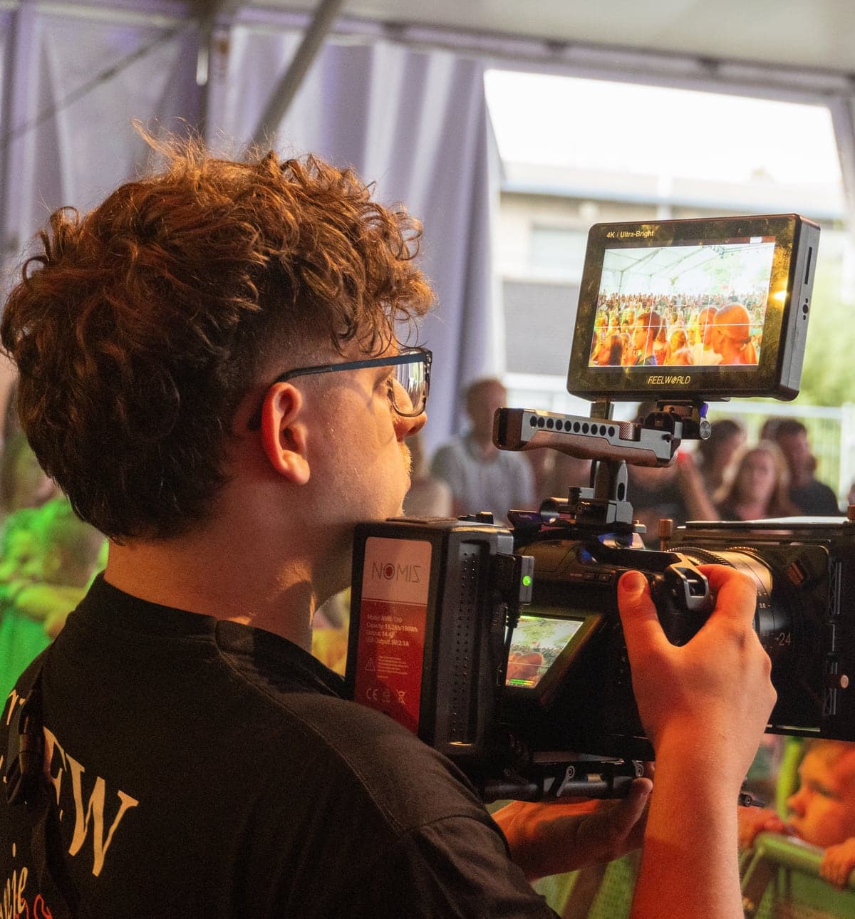 Damian filming at an event